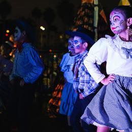 Children dancgin on stage while wearing Candy skull Make UP