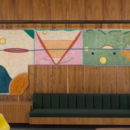 Mixed media artwork on a modern office wall